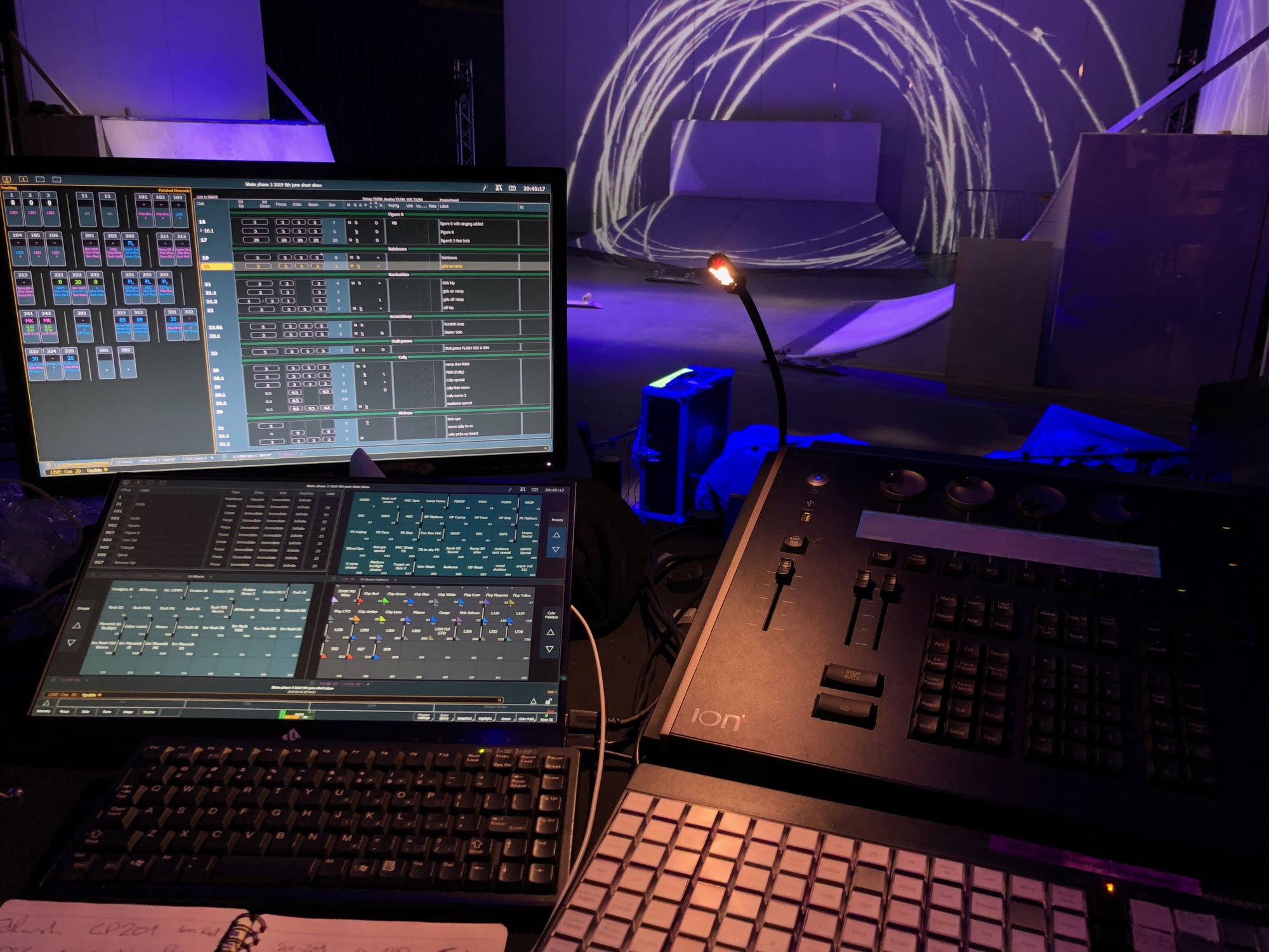 Lighting programming setup with Ion console, programming keyboard, and monitors (one touchscreen)